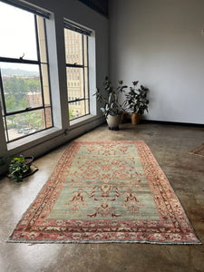 Babouna, antique Kurdish floral rug